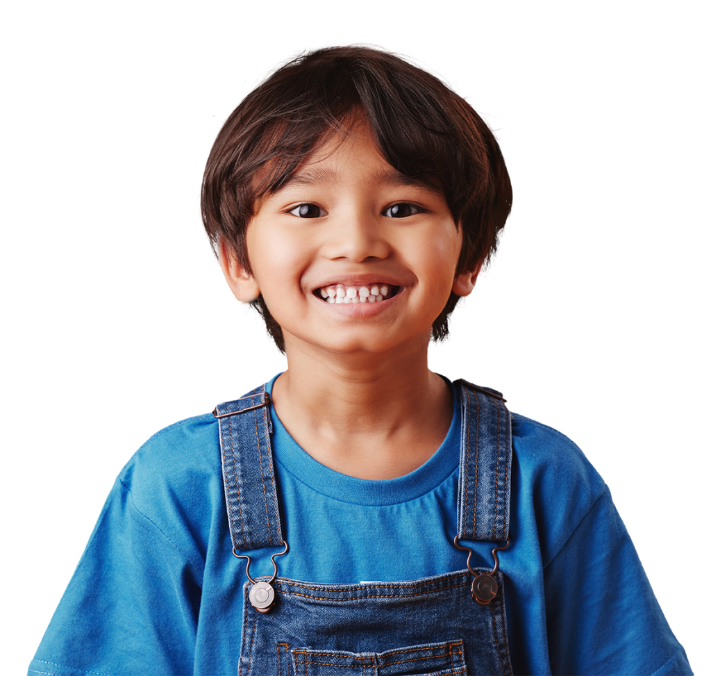 A smiling child with short, dark hair is pictured wearing a blue shirt and denim overalls. The background is white.